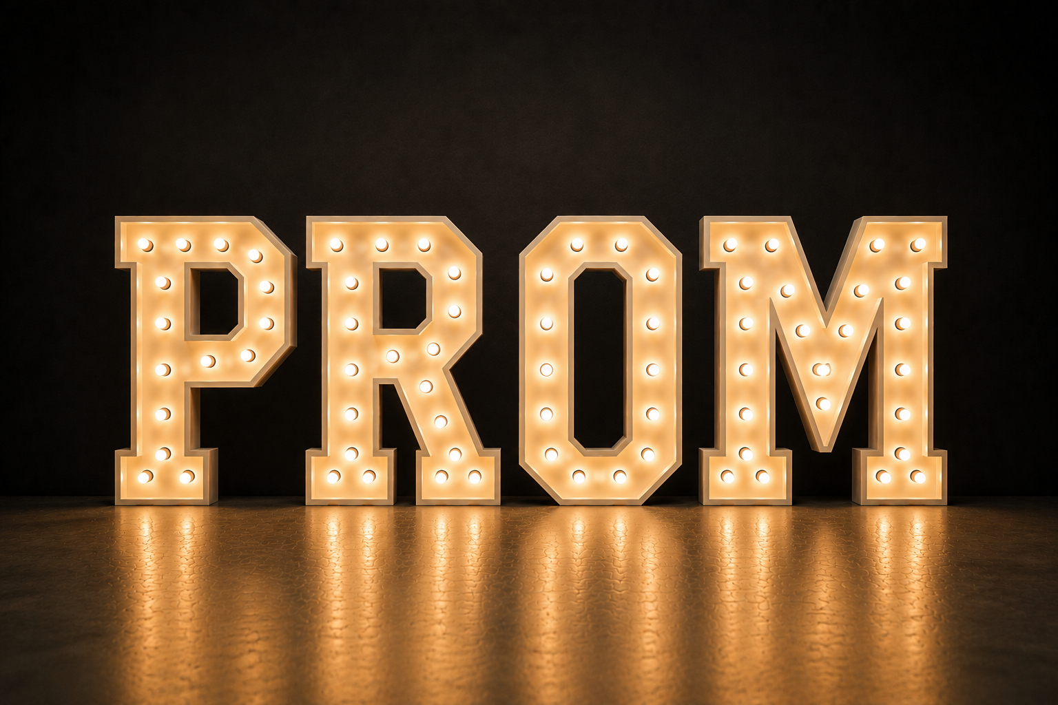 Large illuminated sign spelling 'PROM' with bright bulbs on a dark background.