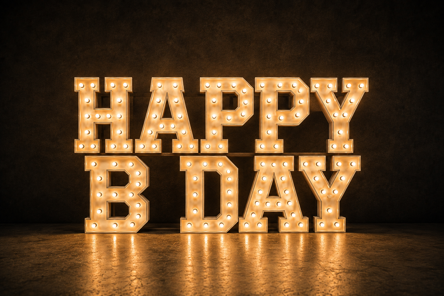 Illuminated marquee sign spelling 'HAPPY BDAY' against a dark background.