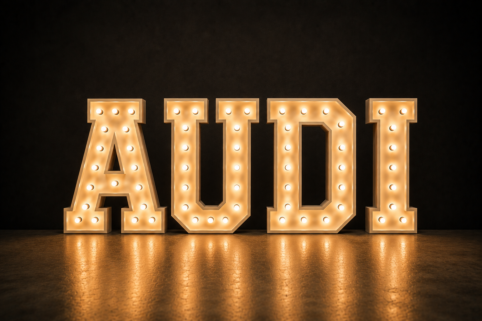 Large illuminated marquee letters spelling 'AUID' on a dark background.