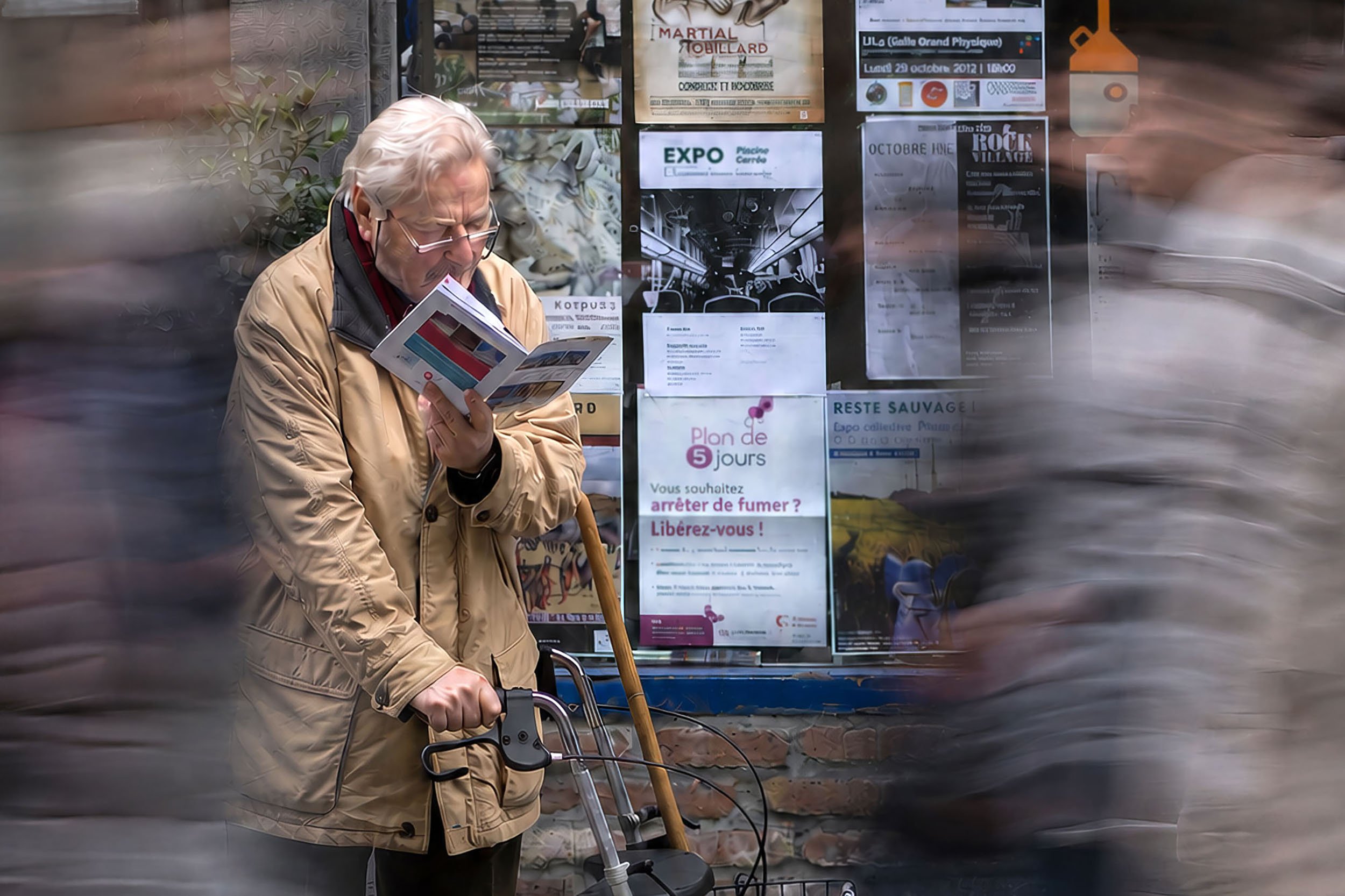 An elderly man with white hair and glasses reading a pamphlet while sitting on a bench, with a blurred motion effect around him, in front of a window displaying various posters and advertisements.