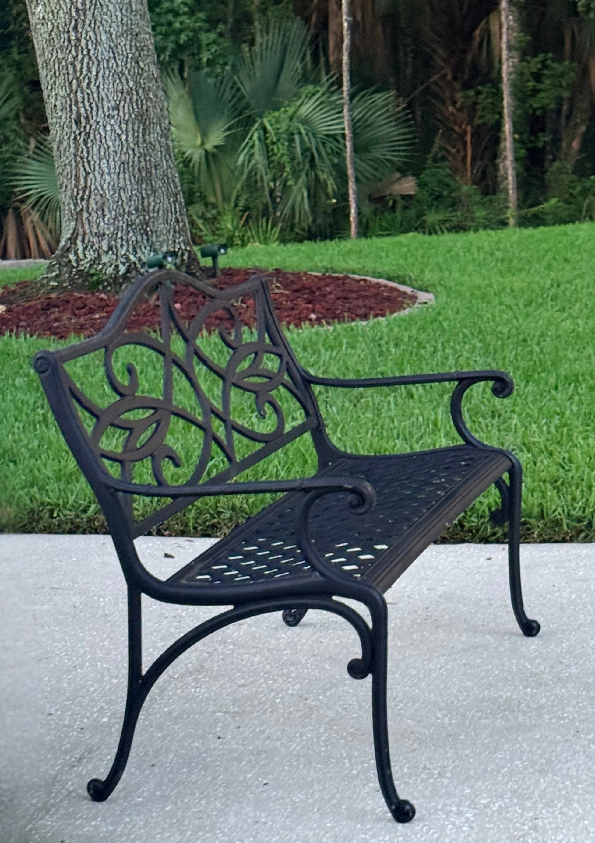 black bench on driveway