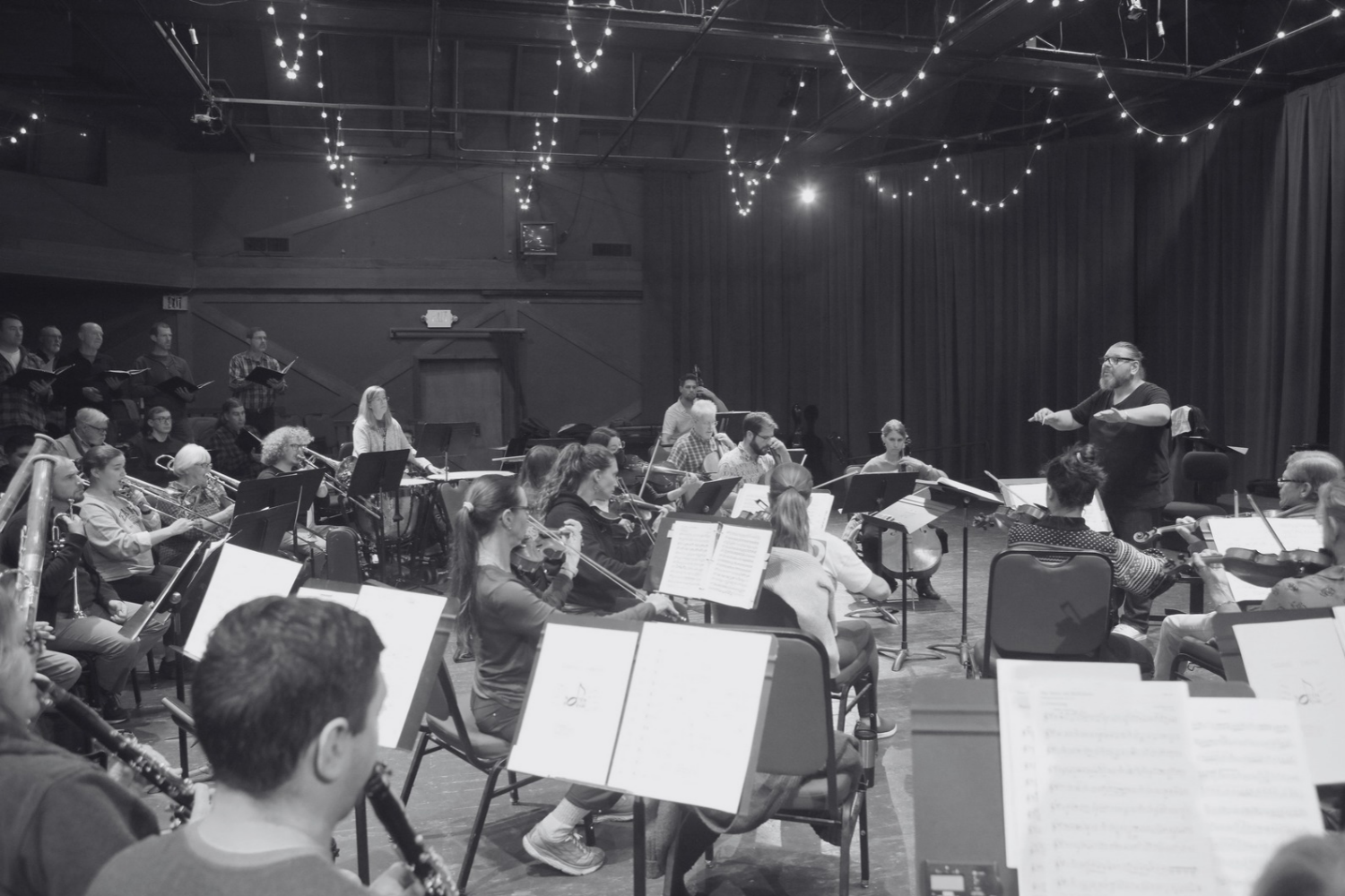 Daniel Henriks conducting orchestra and chorus in rehearsal at Hidden Valley Music Seminars in Carmel, California.