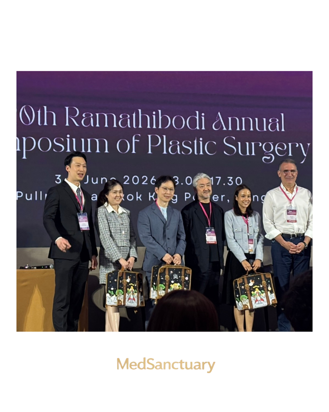 Plastic surgeons posing on stage at the Ramathibodi Annual Symposium of Plastic Surgery
