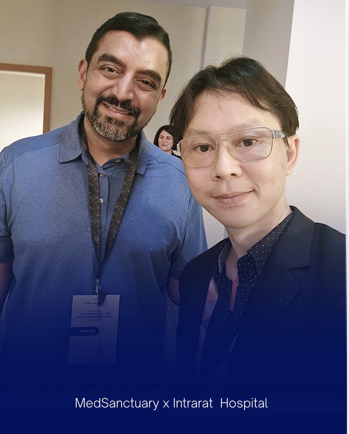 Two people smiling for a selfie, with MedSanctuary x Intrarat Hospital branding