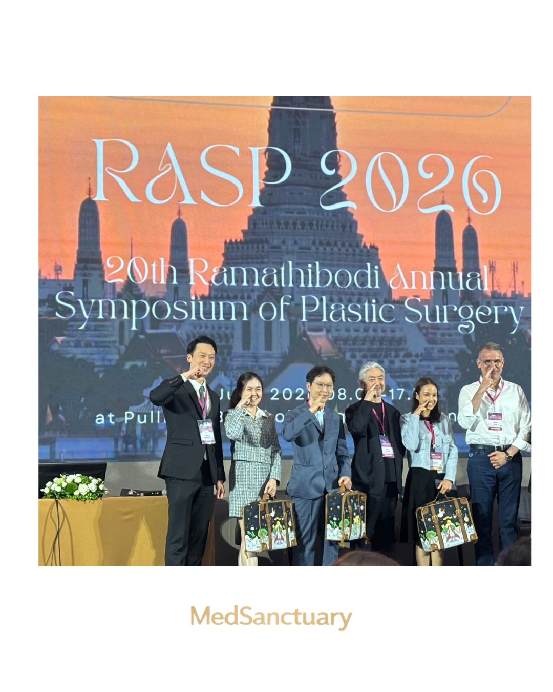 Speakers with commemorative tote bags at RASP 2026, the Ramathibodi Annual Symposium of Plastic Surgery