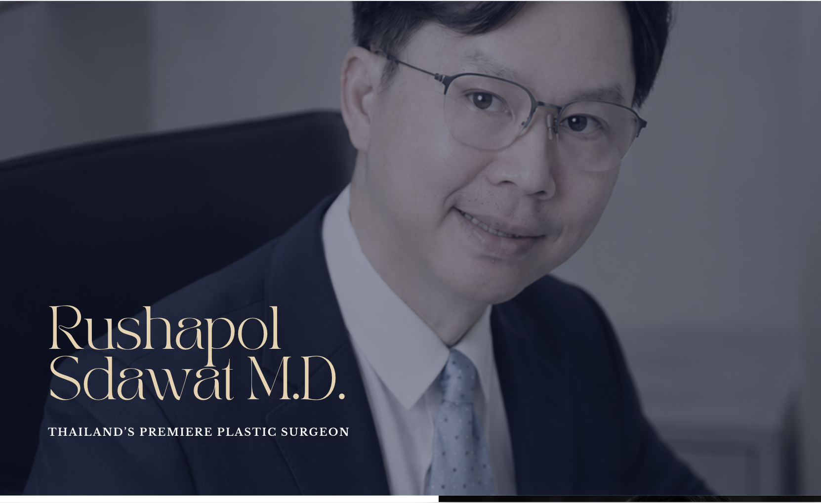 Photograph of a man with glasses, wearing a suit and tie, sitting in an office, with text overlay that reads, 'Rushapol Sdawat M.D. Thailand's premiere plastic surgeon.'