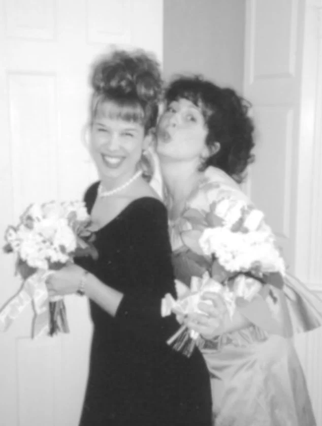 Shows two women, the author and her biological sister, at the author's wedding
