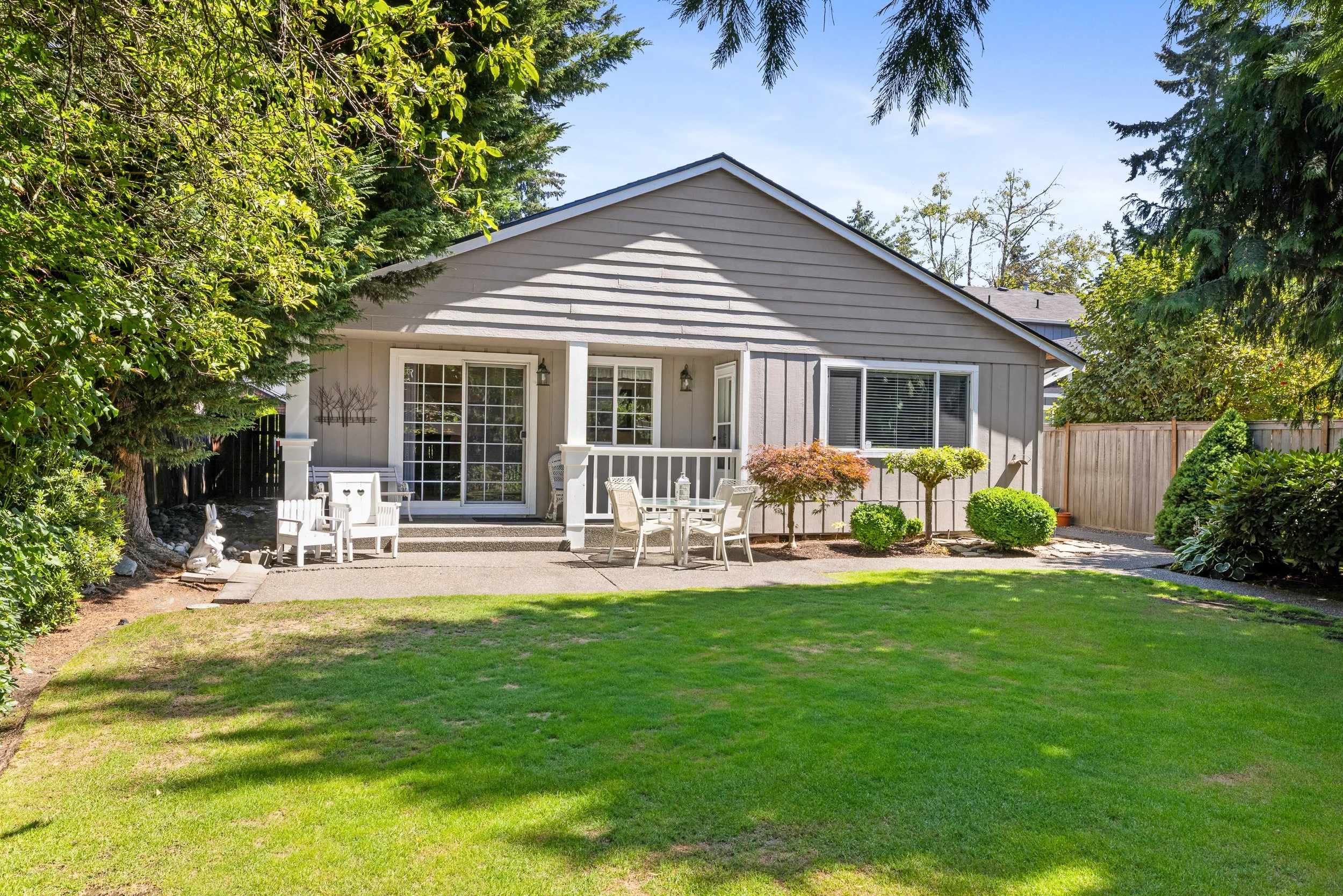 Outdoor patio and charming level yard.