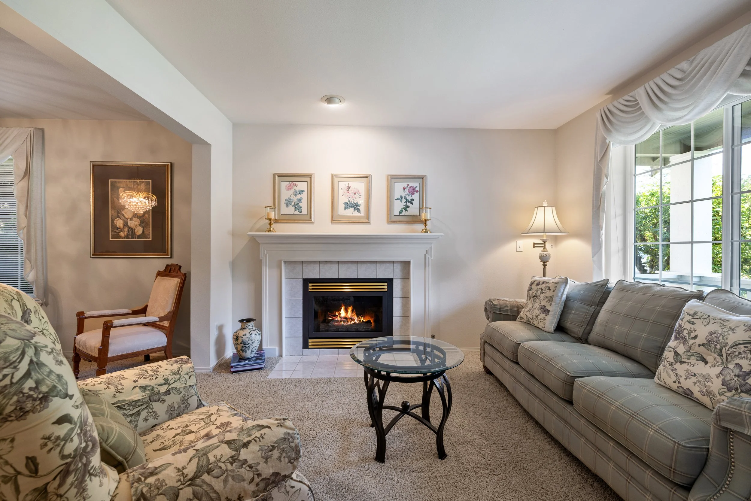 A formal living room with gas fireplace greets you as you enter the home.