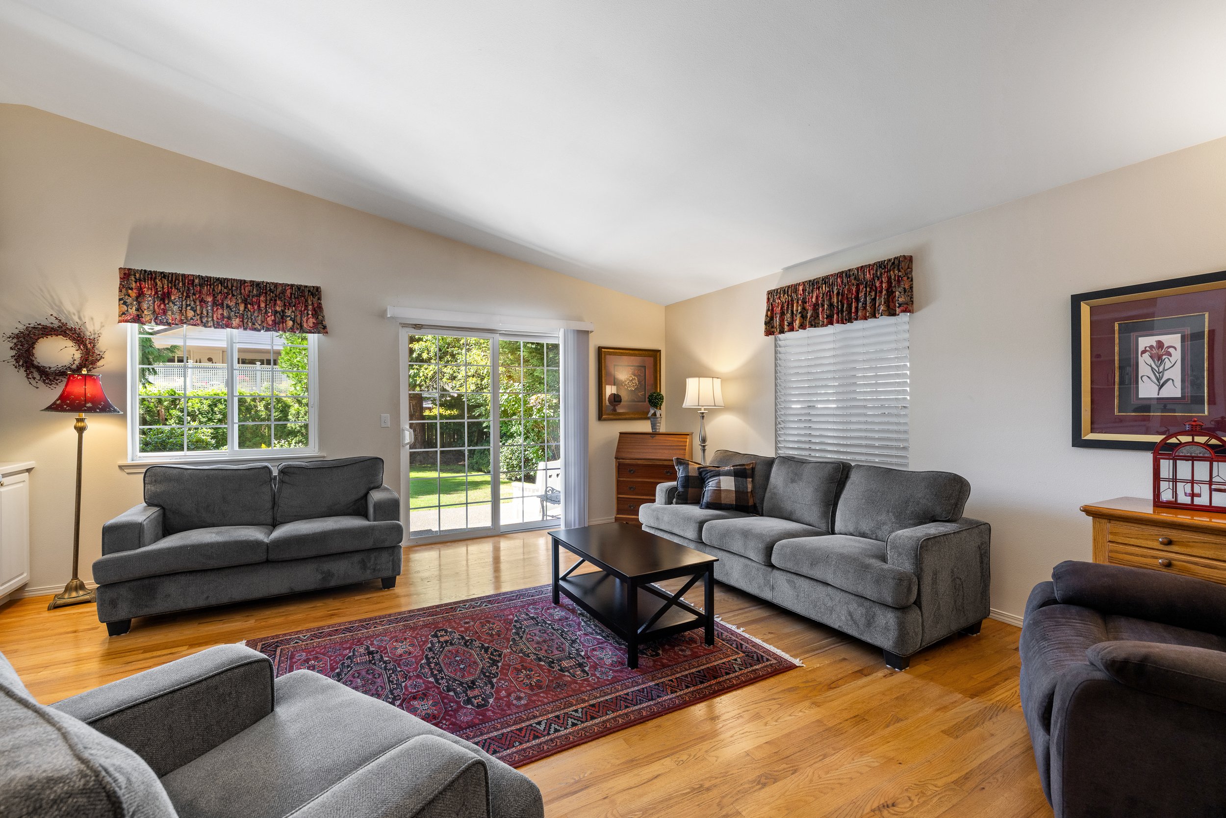 A comfortable space with vaulted ceilings and hardwood floors!