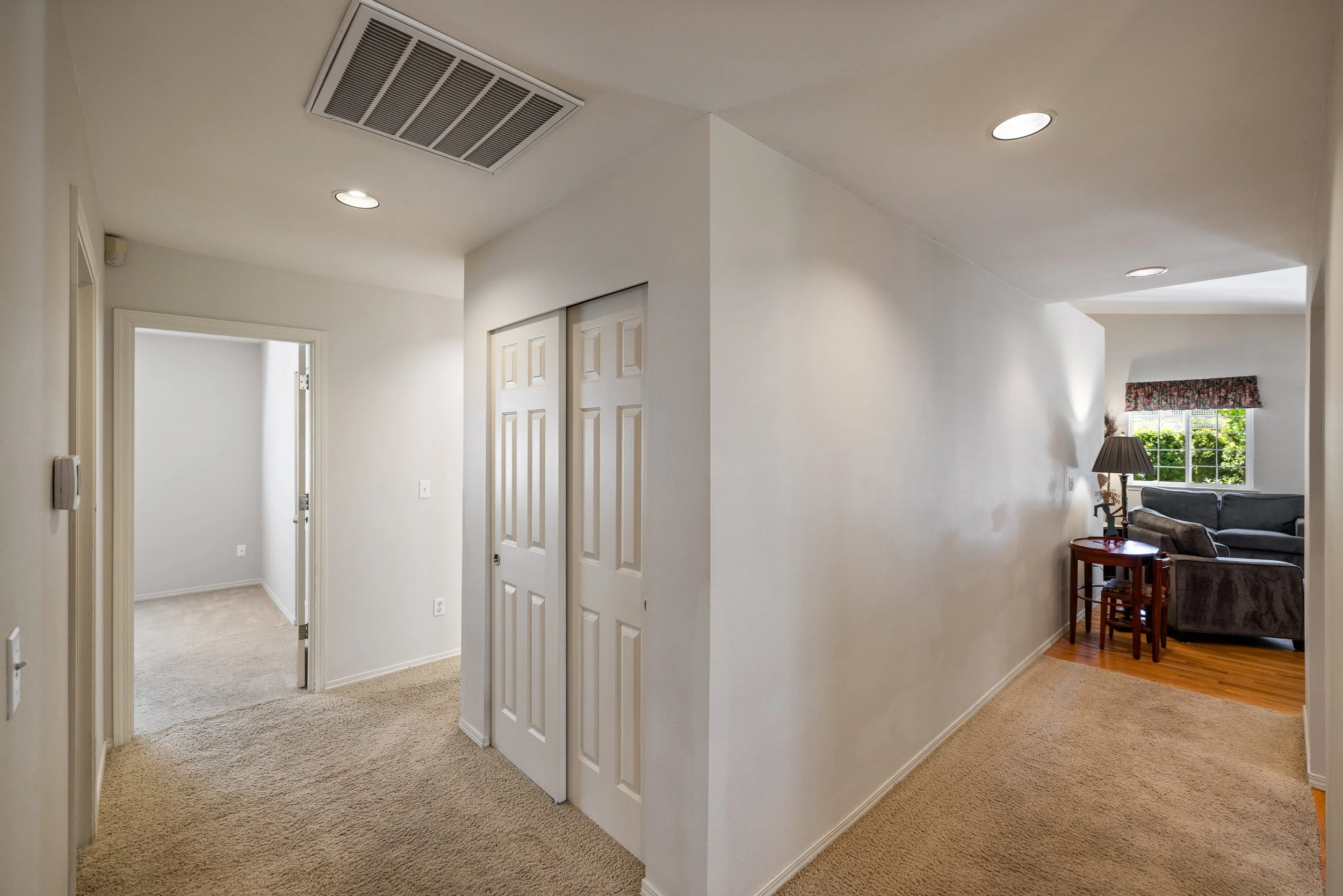 Storage, 3 bedrooms, bathrooms, utility room are all accessed down one hallway, while the kitchen and den offer a more relaxed feel down the other hallway.