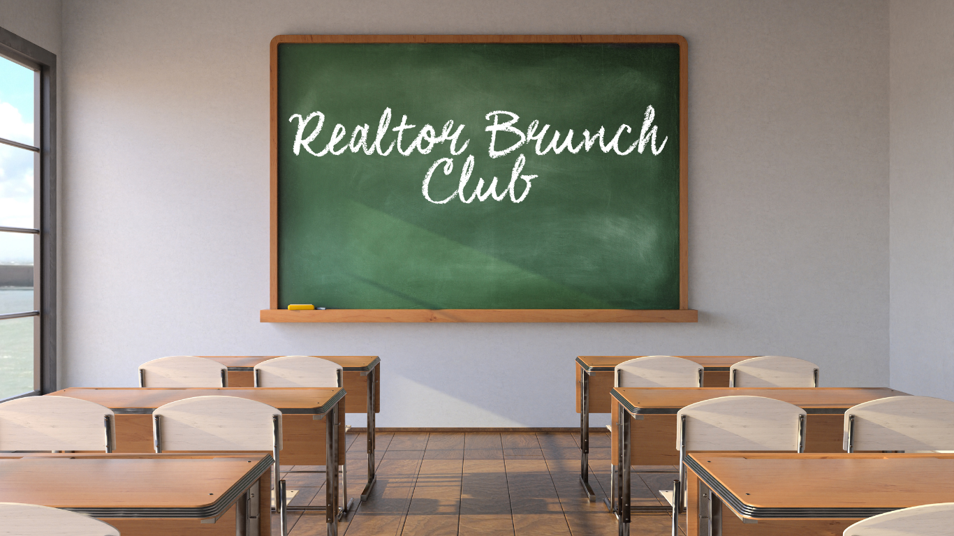 Empty classroom with desks and chairs facing a green chalkboard that reads 'Realtor Brunch Club' in white cursive writing.