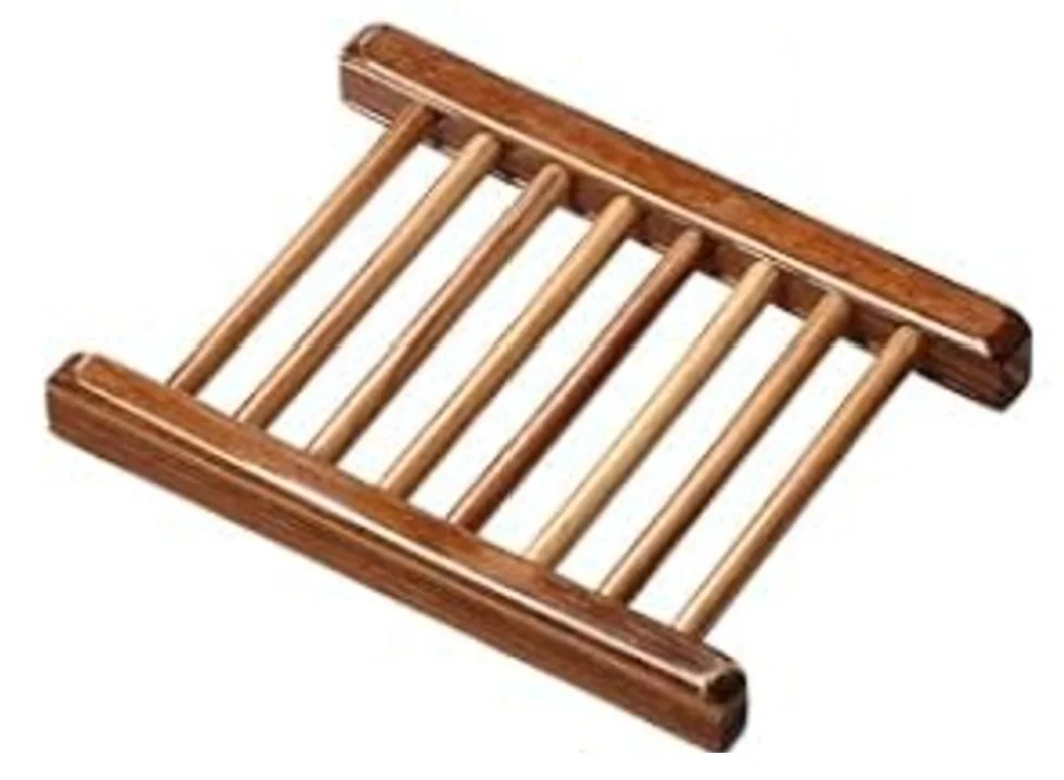 Wooden soap dish with an open slatted design to help handcrafted soap drain, dry, and last longer.