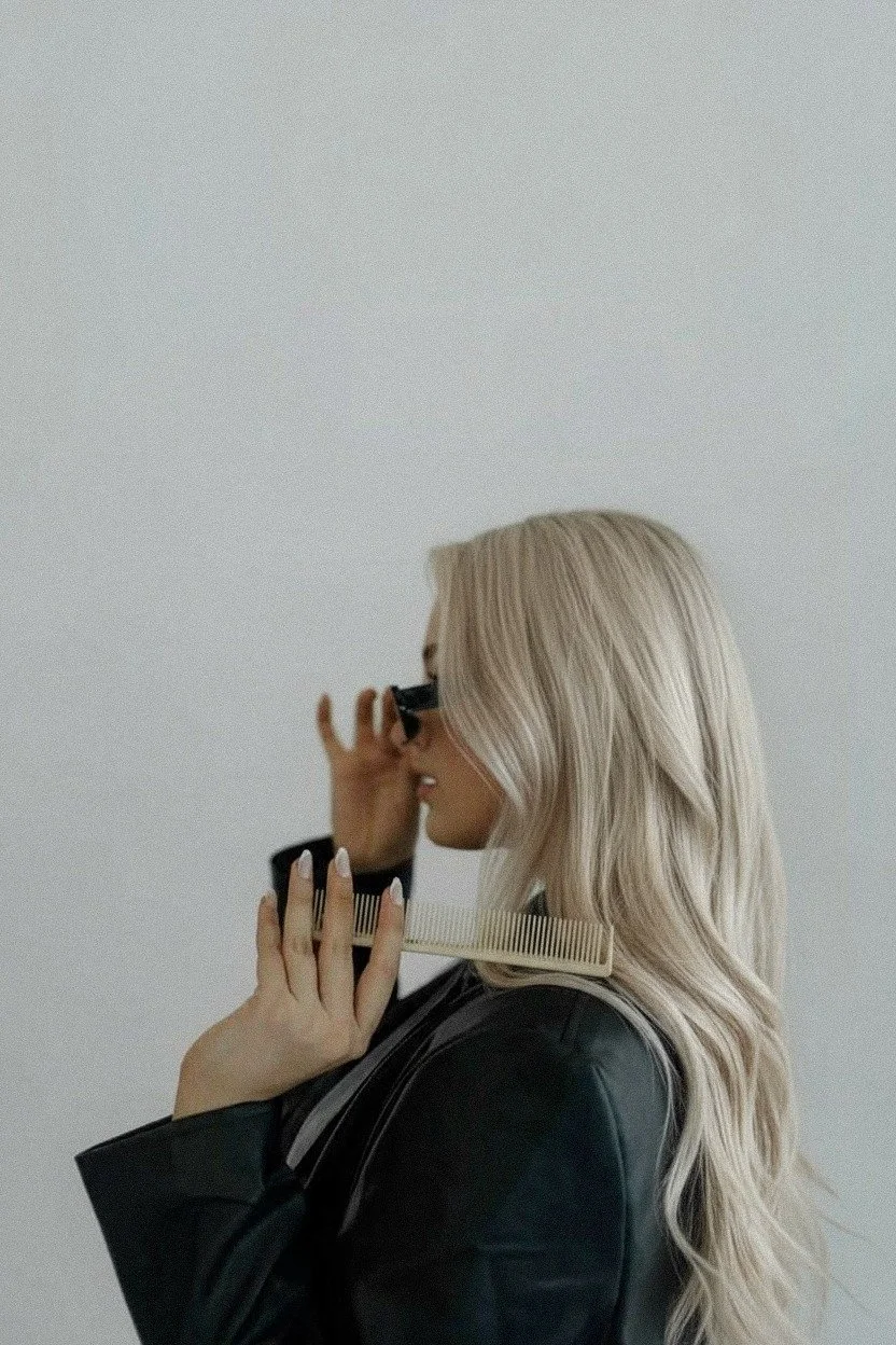 Hair - Woman with platinum blonde hair taking photograph - TVS.jpg