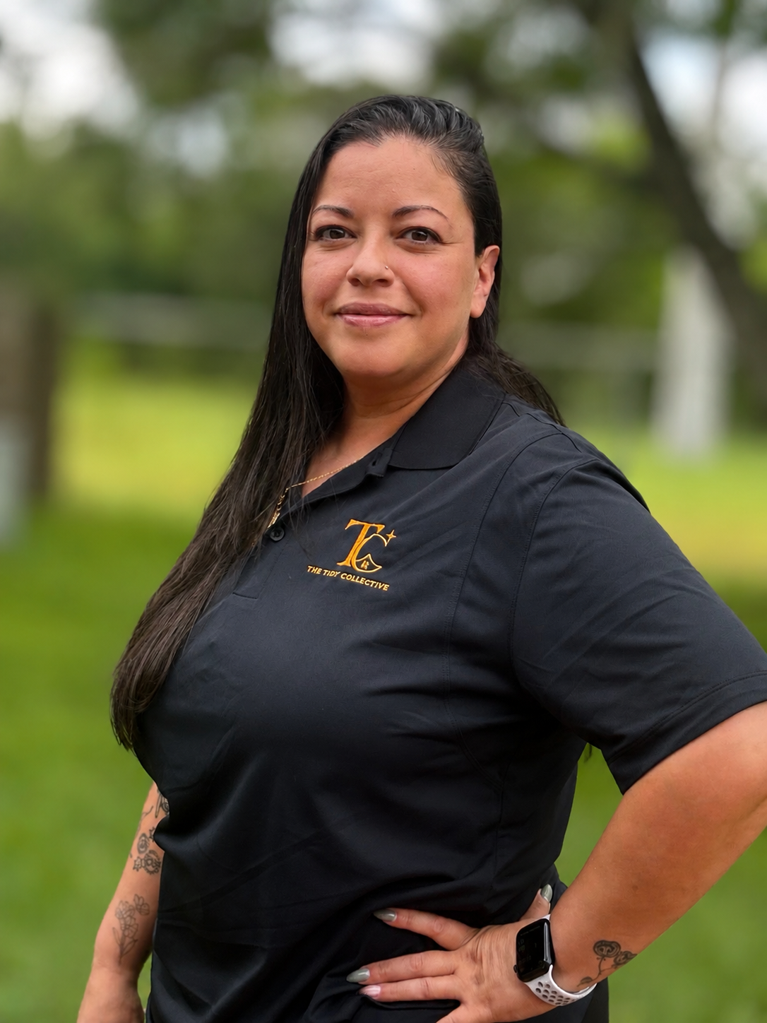 Veronica Rodriguez, owner of The Tidy Collective LLC, wearing a branded black polo outdoors.