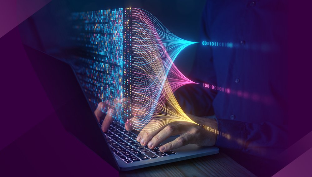 A person working on a laptop with colorful digital data streams and neural network visualization emerging from the screen.