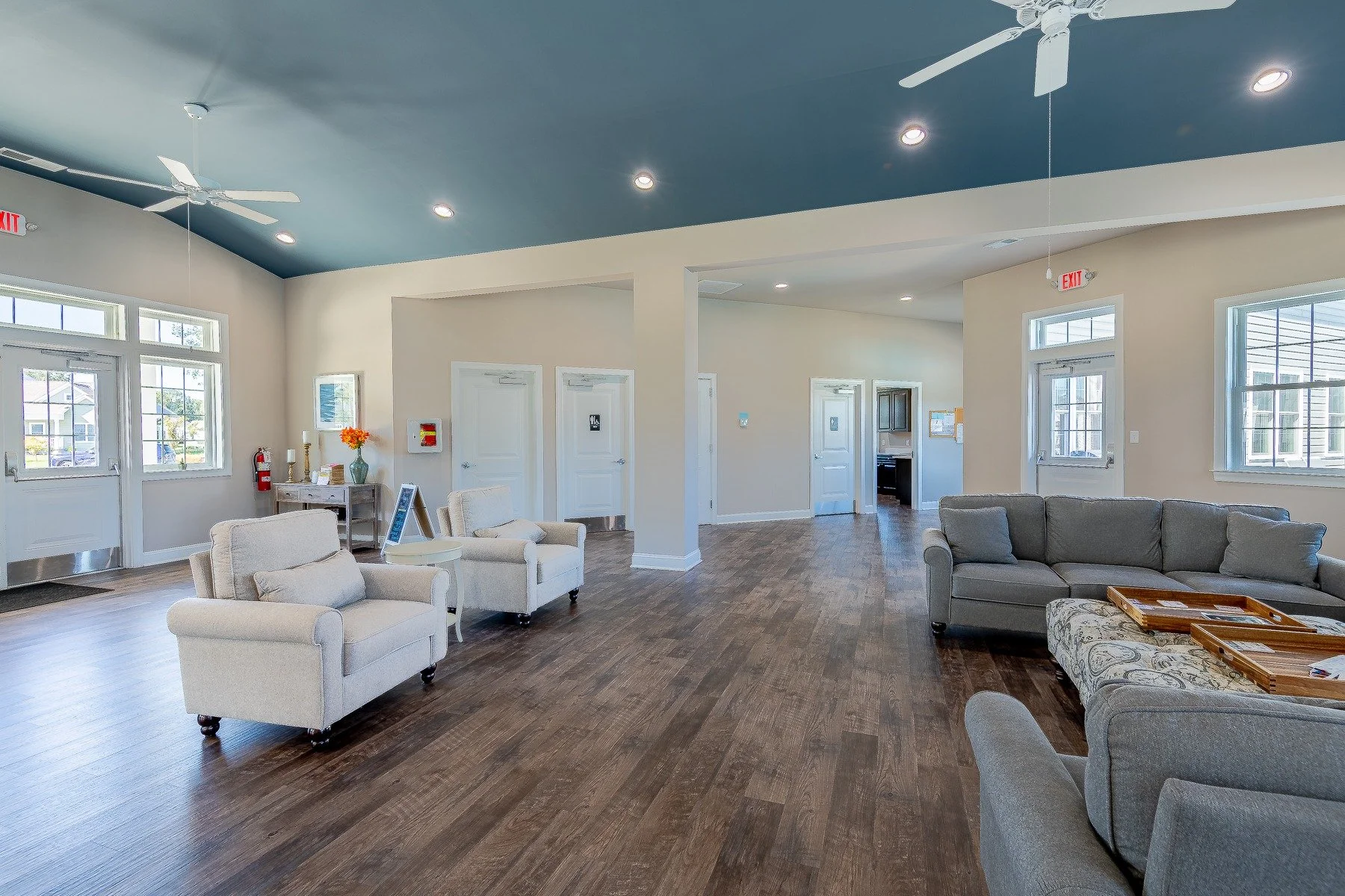 Community clubhouse seating area with vaulted ceiling.