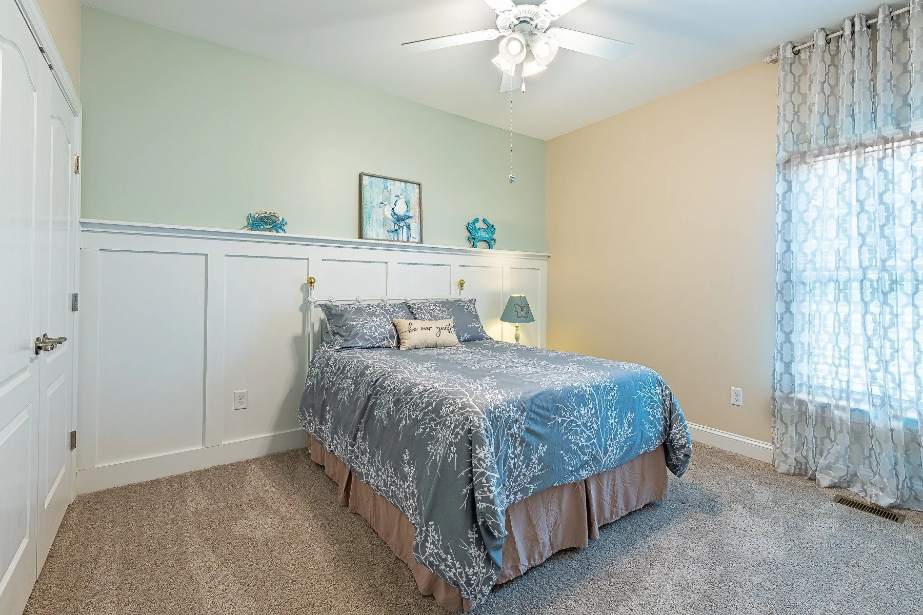 Second guest bedroom with custom wall paneling at 28839 W Henry Place.