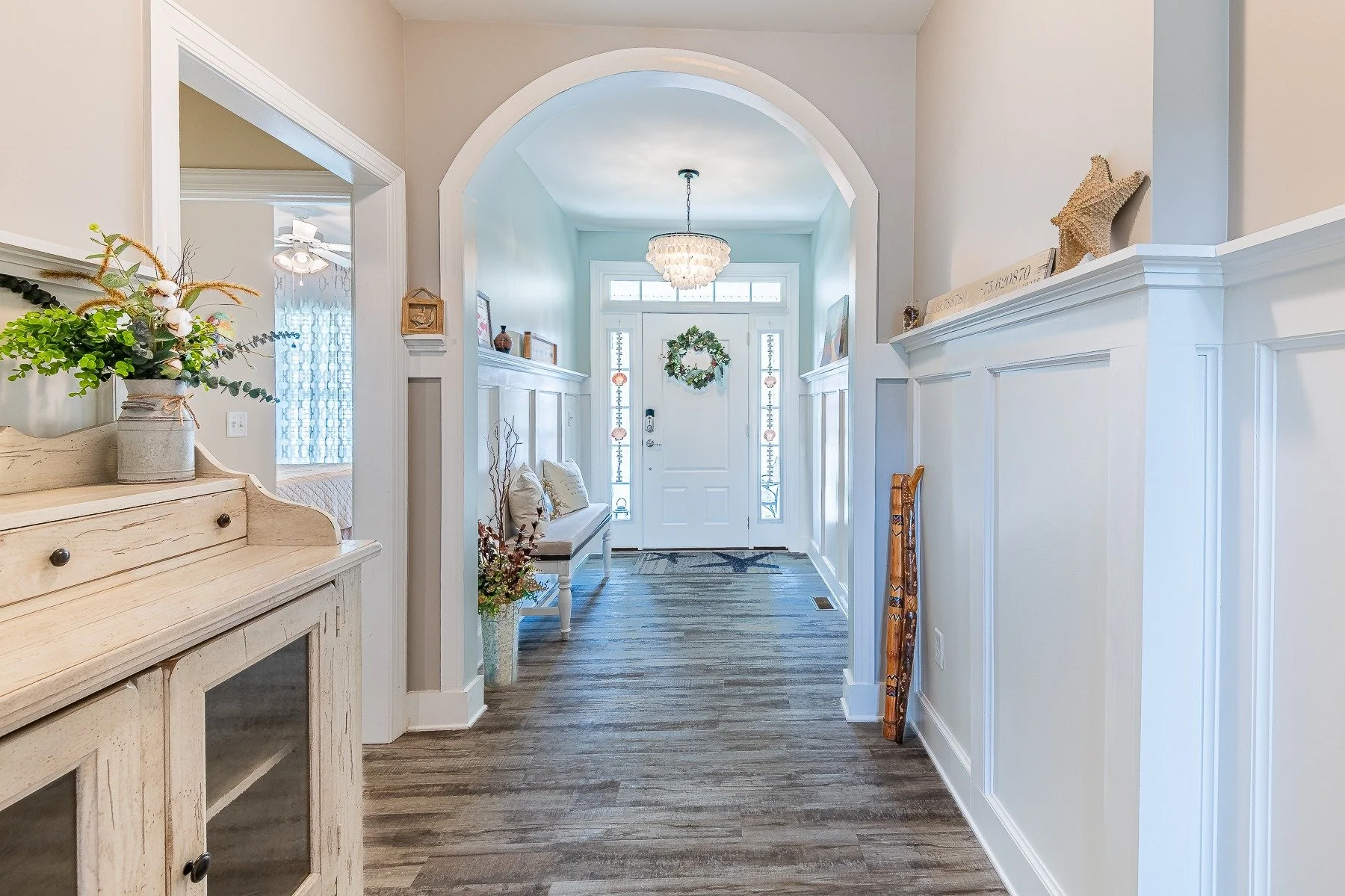 Welcoming foyer with decorative archway and coastal-style details at 28839 W Henry Place.