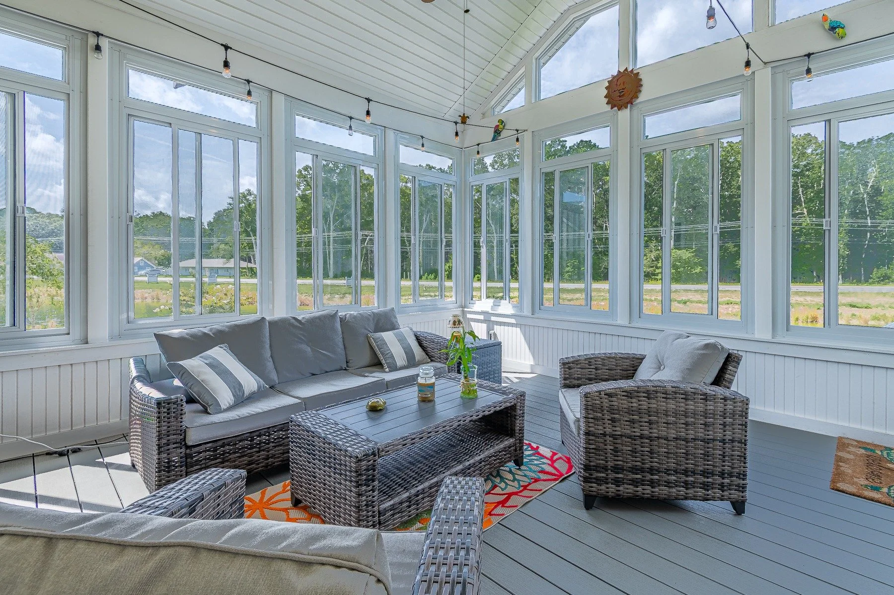 Bright screened porch with vaulted ceiling and pond views at 28839 W Henry Place.