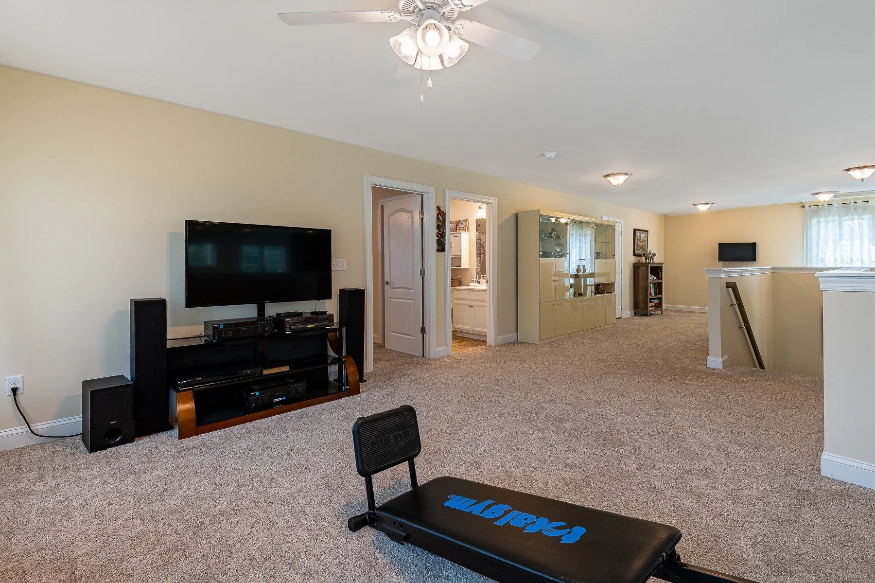 Large upstairs loft with media area and adjacent rooms at 28839 W Henry Place.