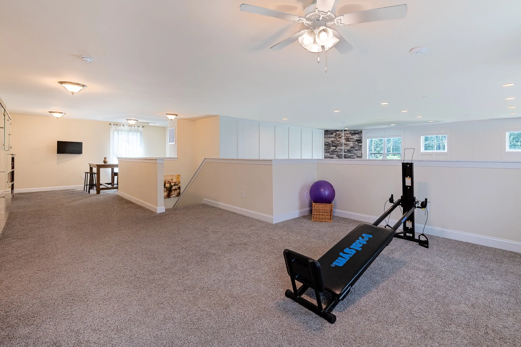 Expansive upstairs loft with flexible recreation space at 28839 W Henry Place.