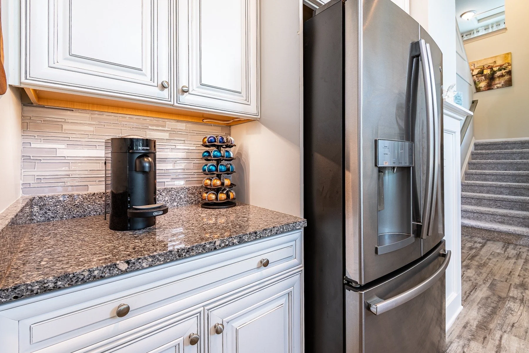 Built-in coffee station and stainless refrigerator at 28839 W Henry Place.