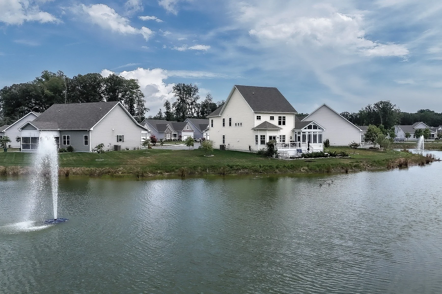 Wide pond view with 28839 W Henry Place in the background.