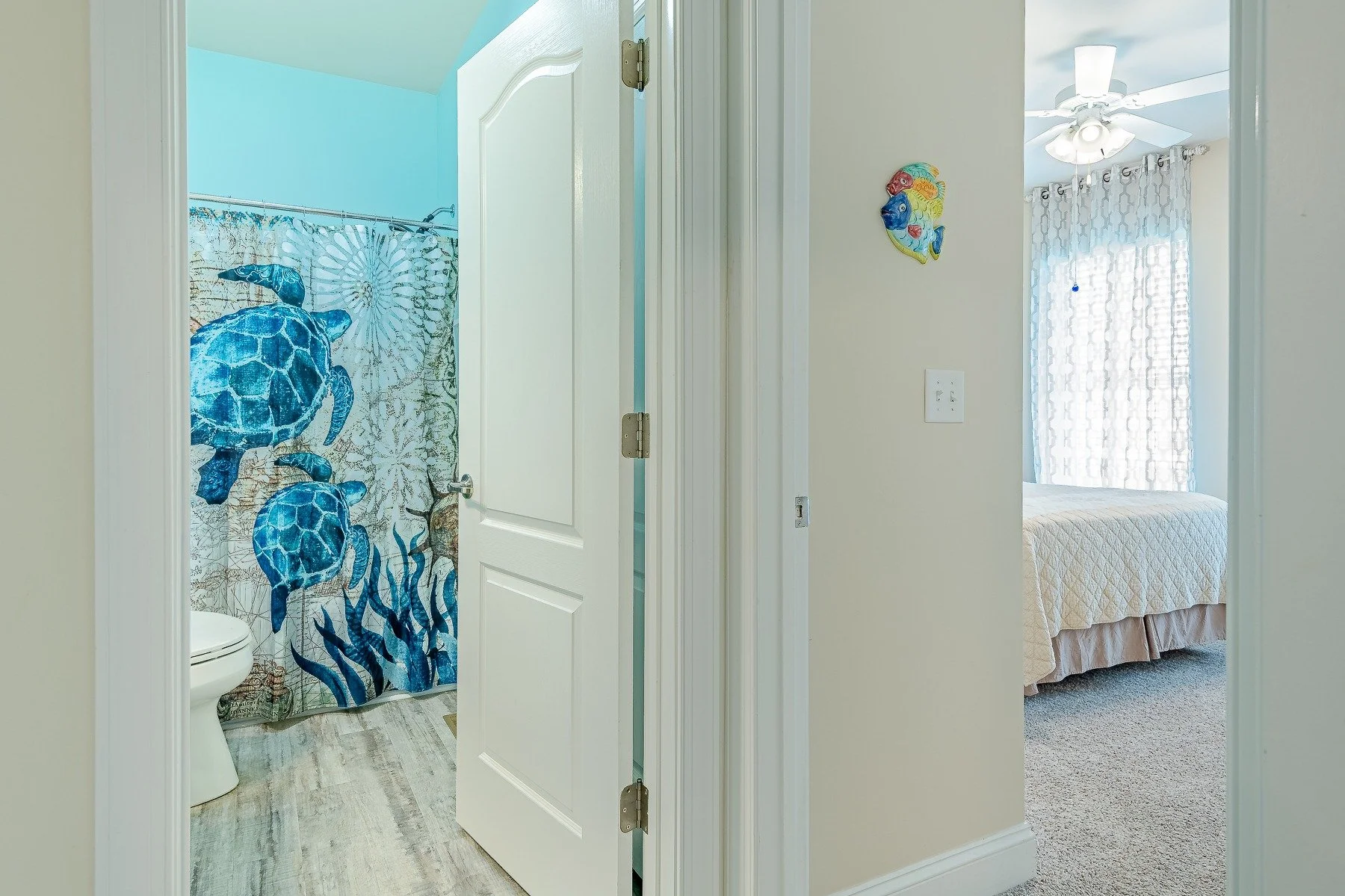 Guest bedroom and adjacent full bathroom at 28839 W Henry Place.