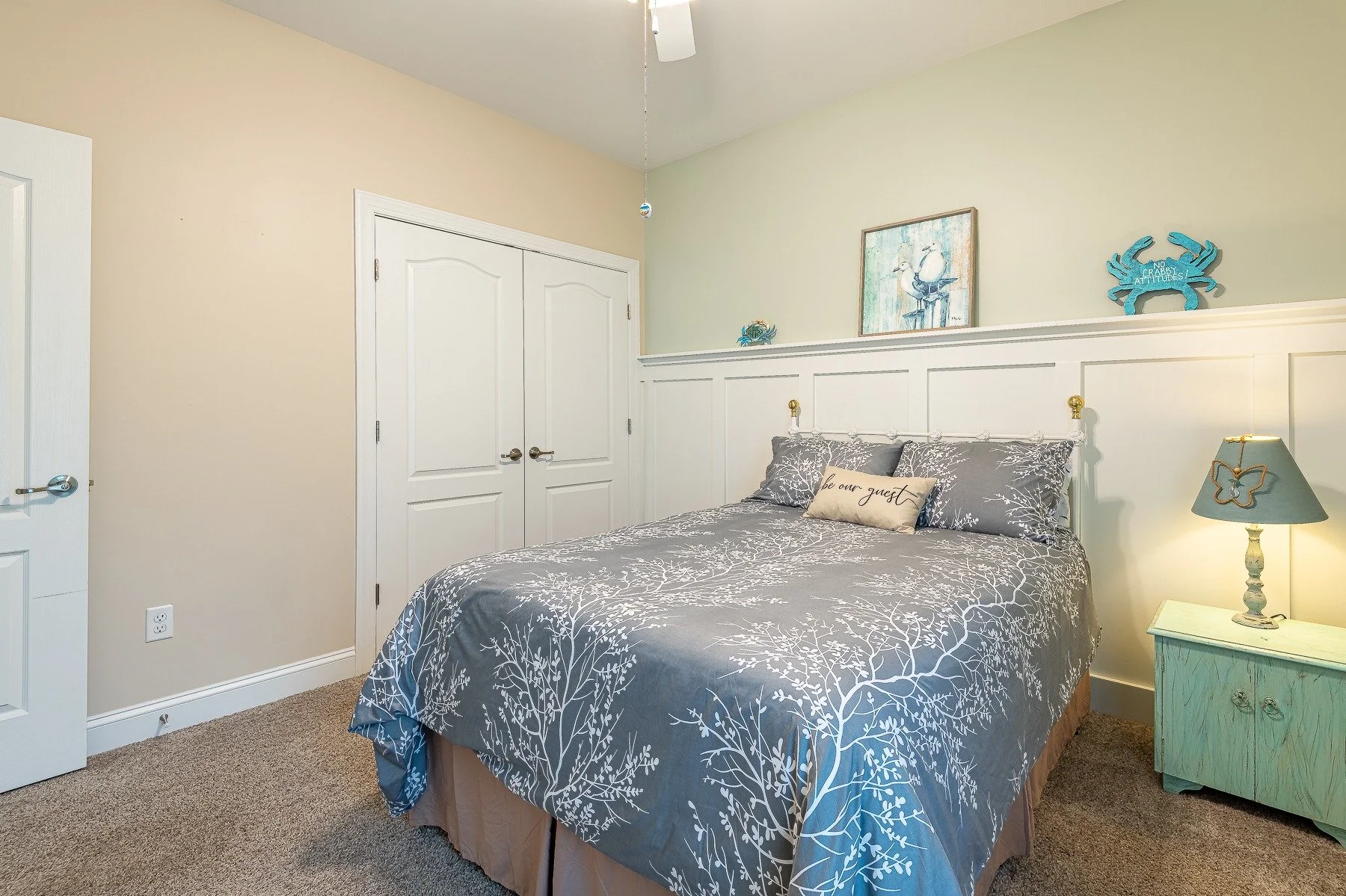 Second guest bedroom with double closet and coastal decor at 28839 W Henry Place.