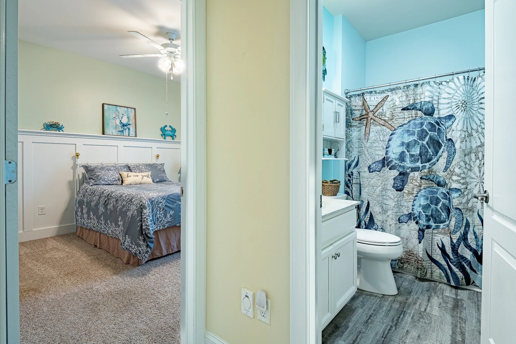 Guest bedroom with direct access to a coastal-themed full bathroom at 28839 W Henry Place.