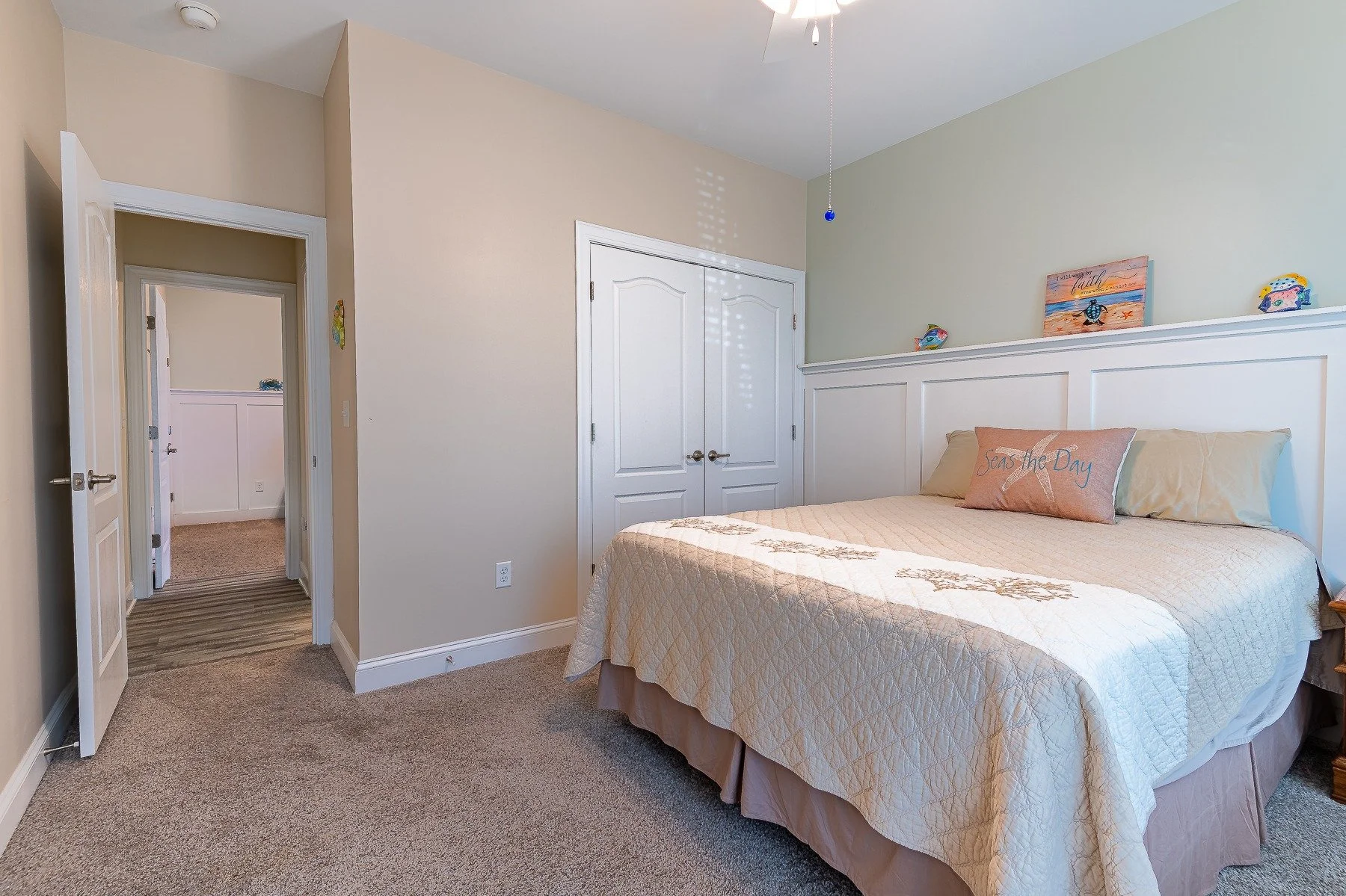 Bright guest bedroom with high ceiling and custom wall trim at 28839 W Henry Place.