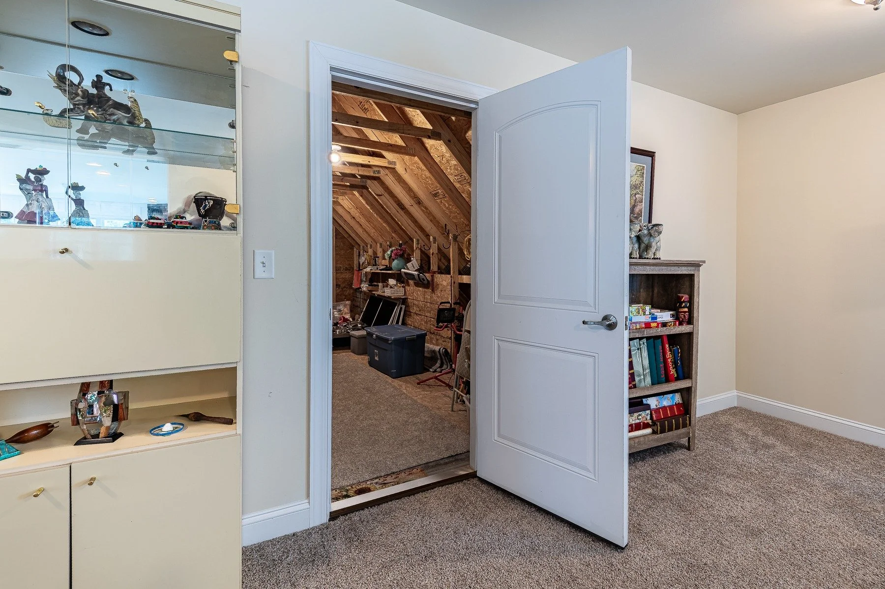 Upstairs loft with access to a large unfinished storage room at 28839 W Henry Place.