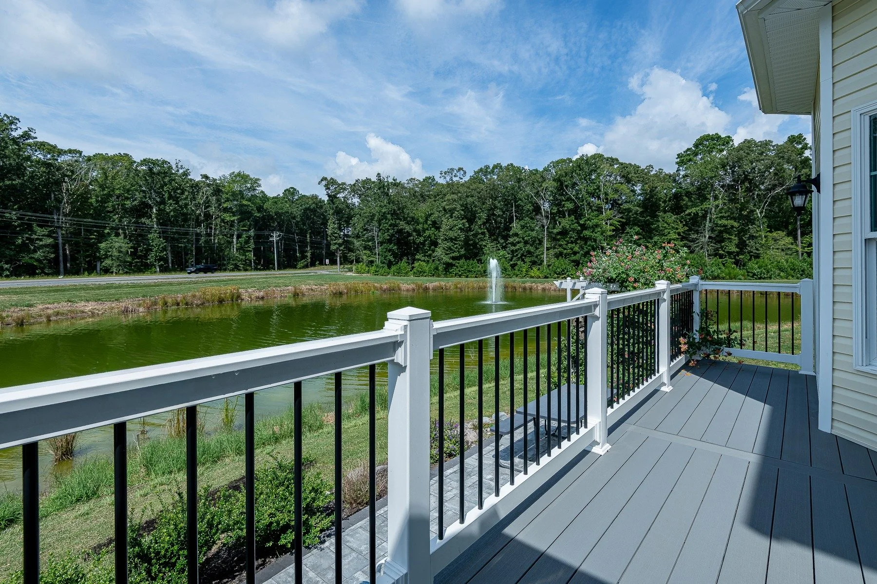 Deck overlooking the pond and fountain at 28839 W Henry Place.