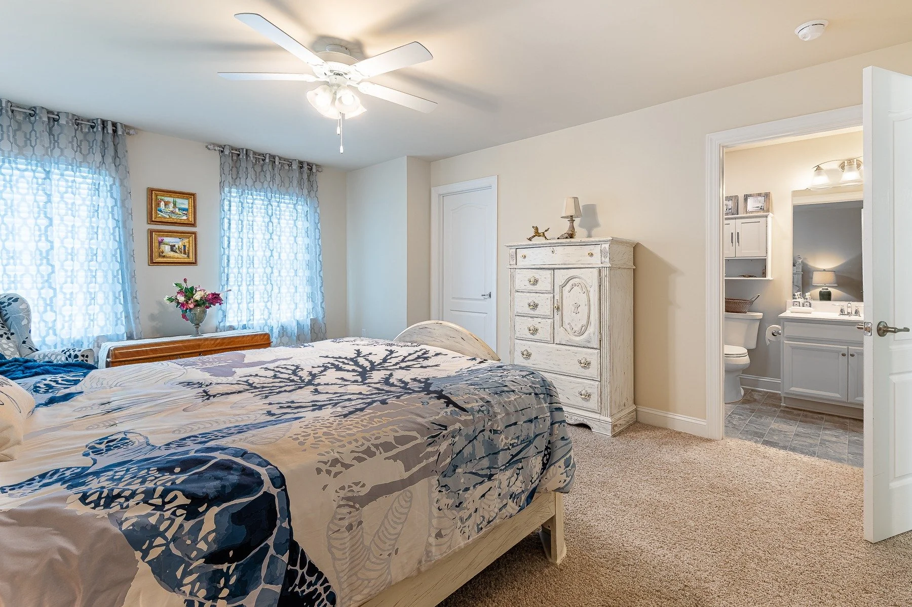 Upstairs bedroom with adjacent full bathroom at 28839 W Henry Place.