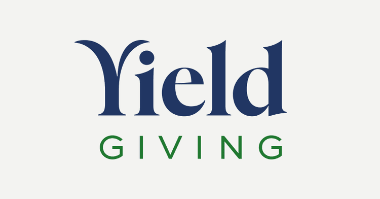 Logo with the words 'Yield Giving' written in blue and green text.