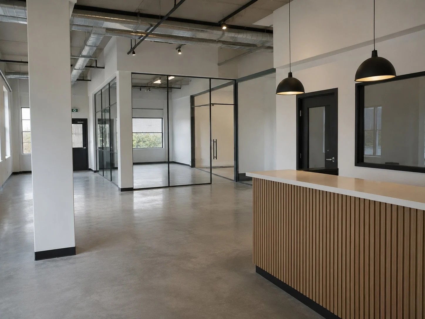 Modern, minimalistic office interior with glass partitions, black-framed doors, pendant lights, and a wooden reception counter.