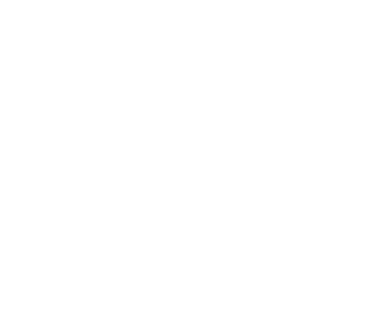 A person standing at a crossroads with multiple directional signs.