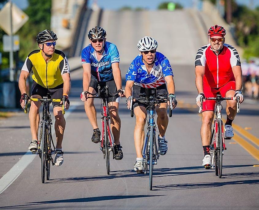 4 club cyclists riding away from Don Cesar in St Pete Beach