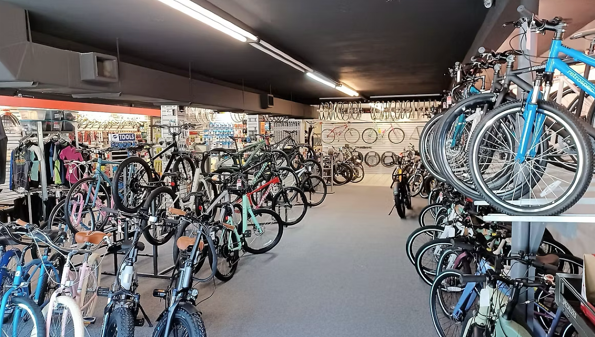 Inside view of a bike shop with lots of bikes for sale or rent