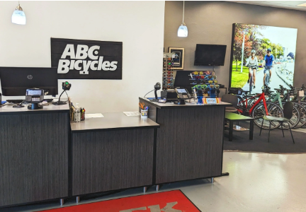 View of bike shop showing reception desk and bikes for rent