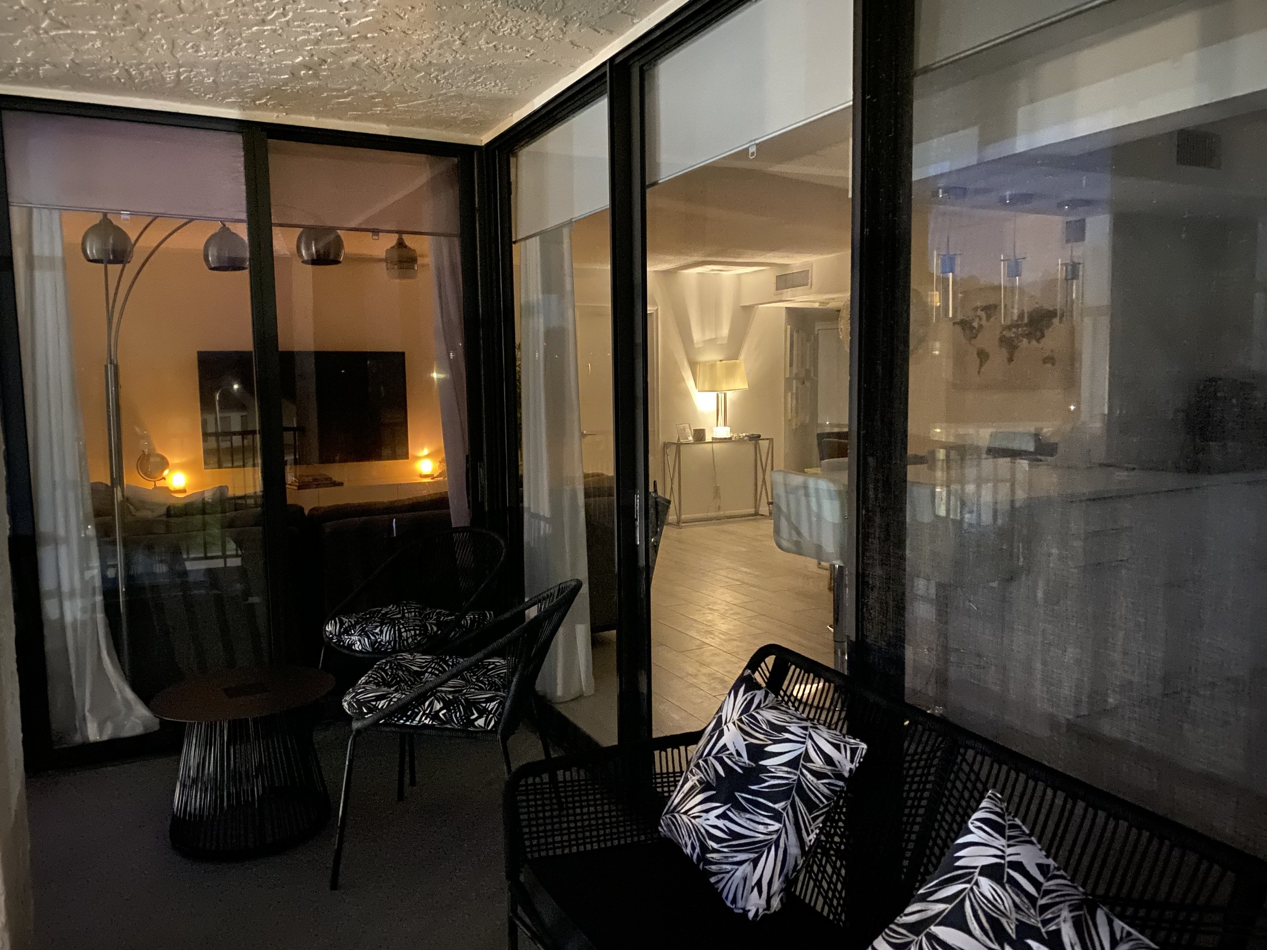 Evening view of balcony looking into open plan living space
