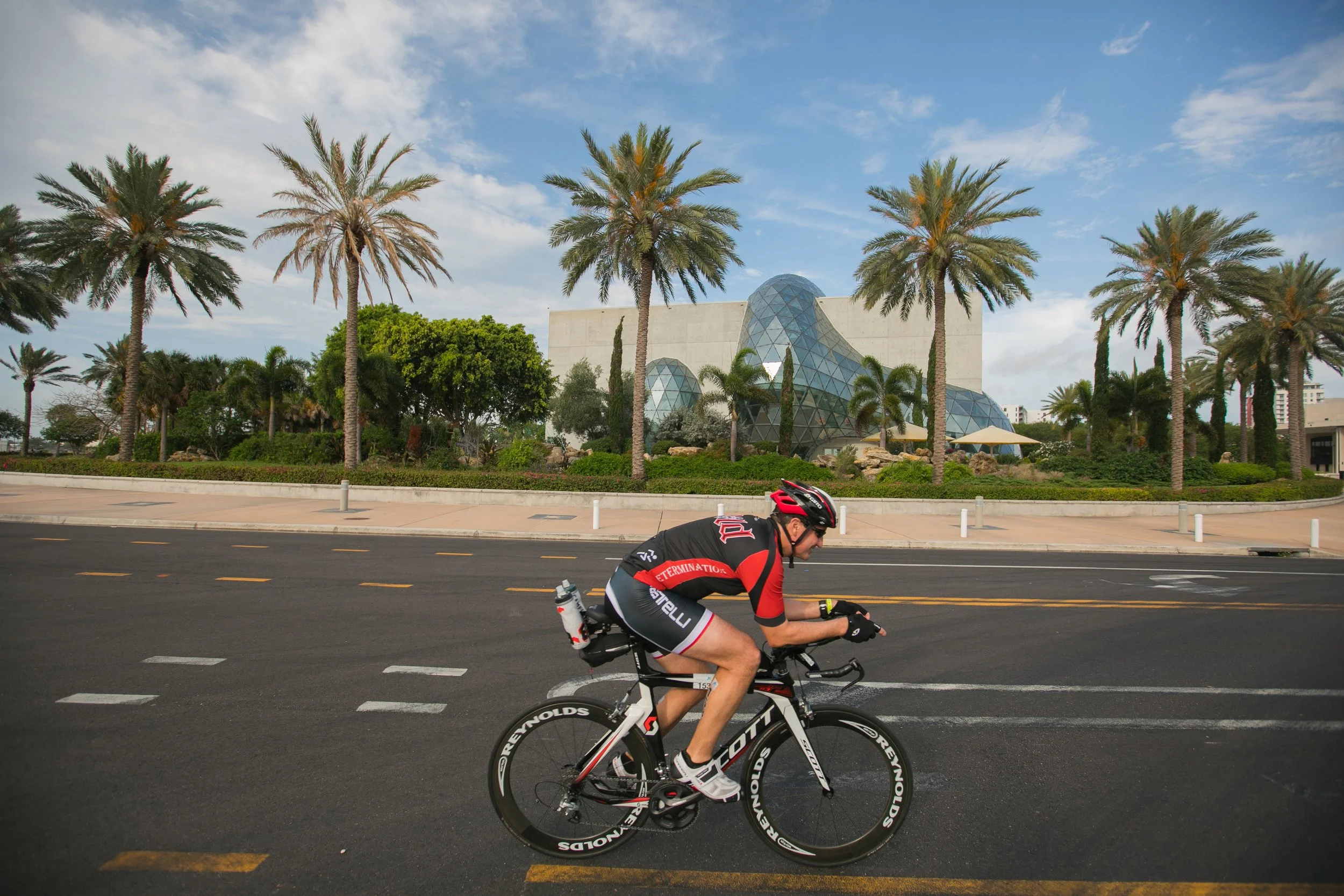 Club cyclist racing in front of Dali museum on racing bike and enjoying the Florida cycling holiday