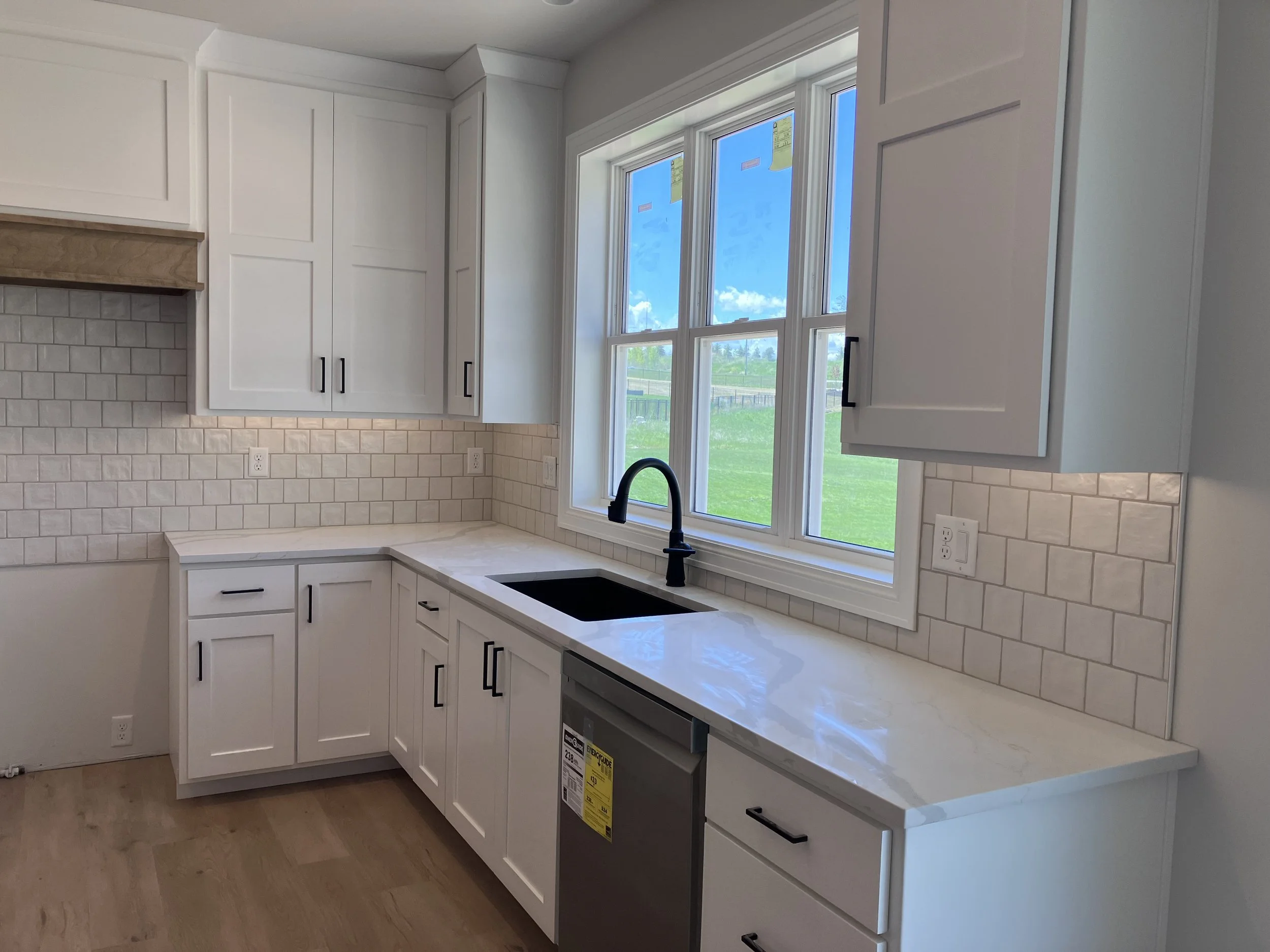 Modern kitchen with white ceramic tile backsplash