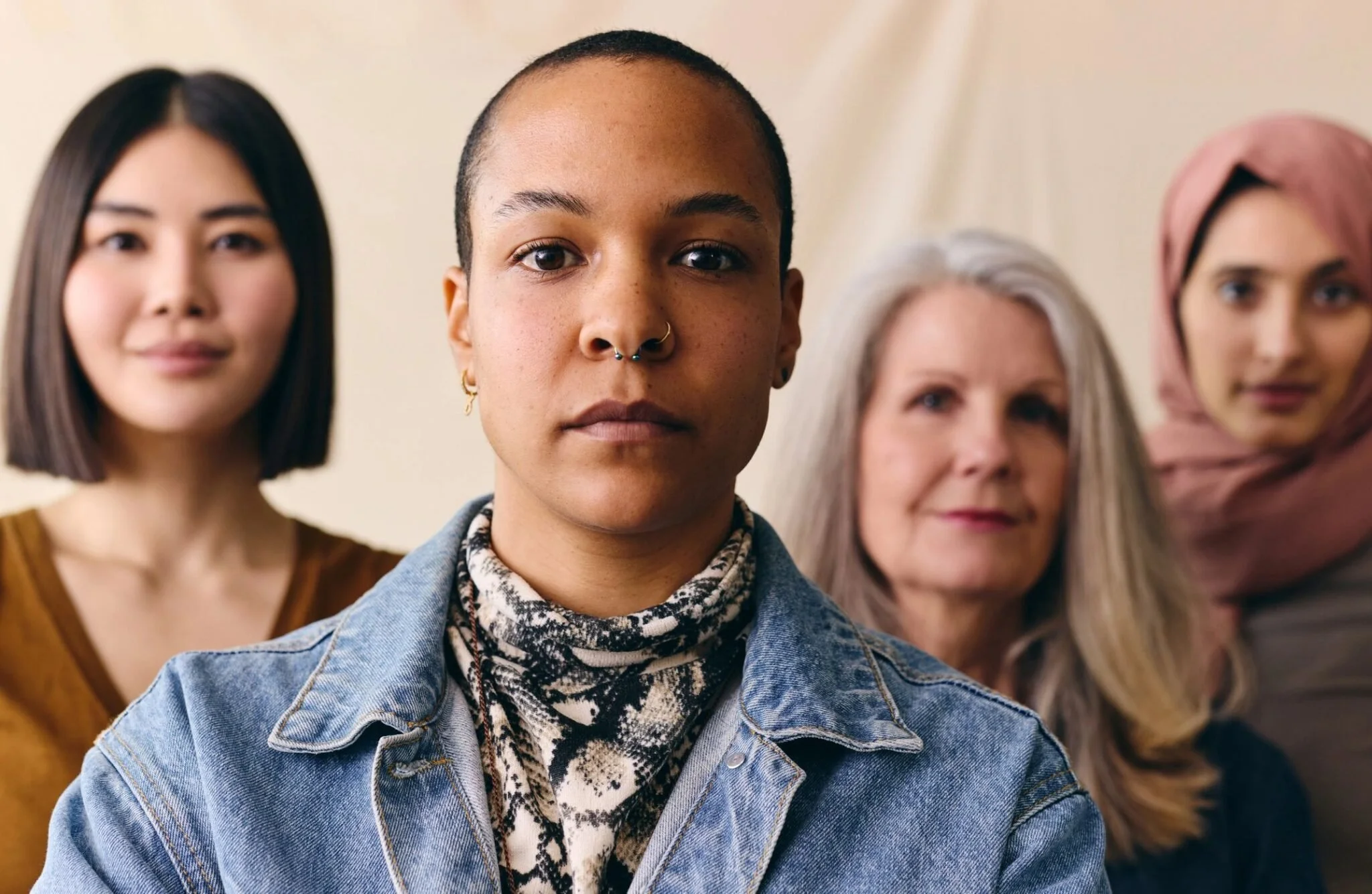 "Group of women of different ages and backgrounds standing together, representing NCWEG's Sacred Hearts community"