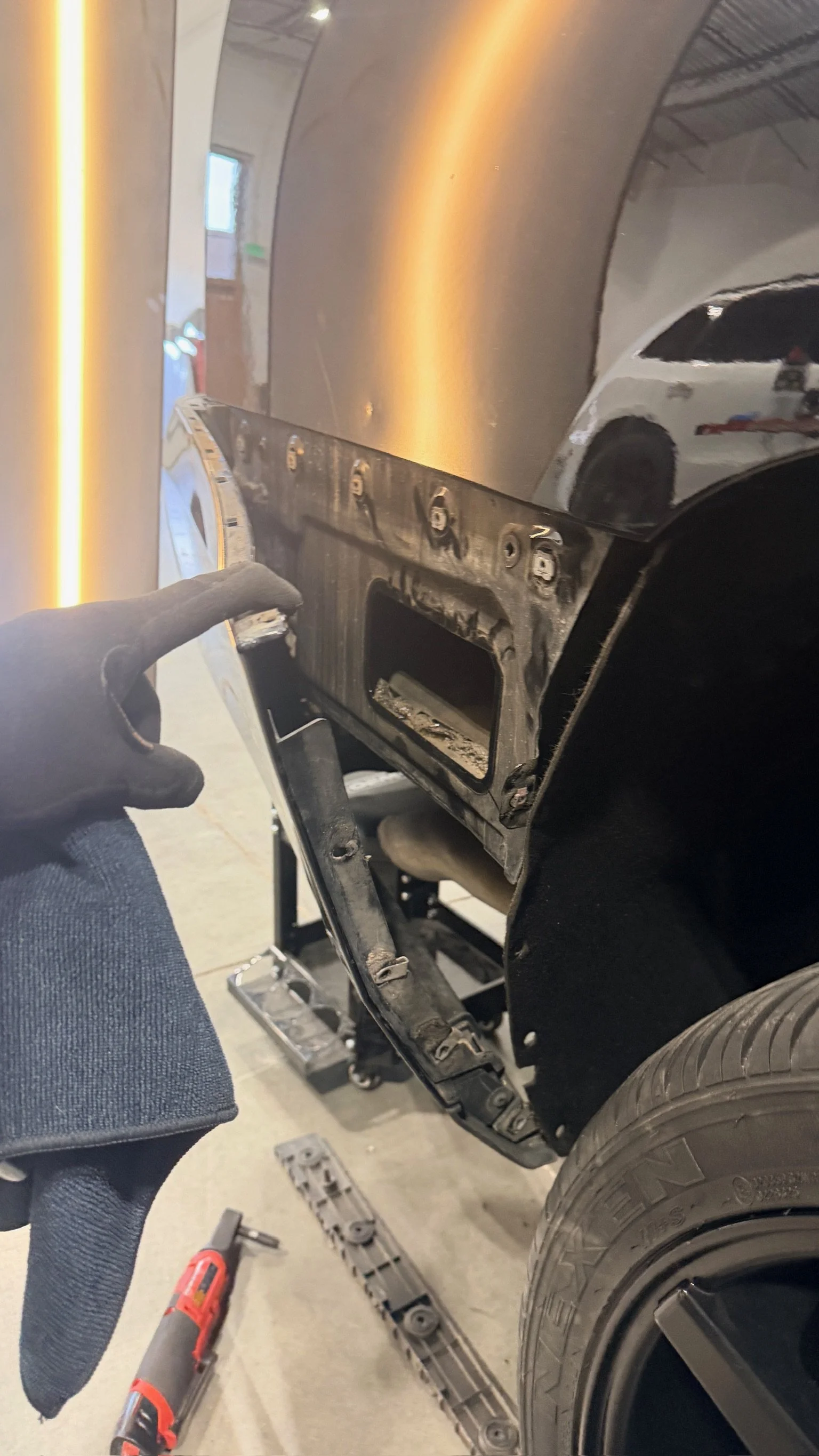 Minor impact damage being evaluated for paintless dent repair