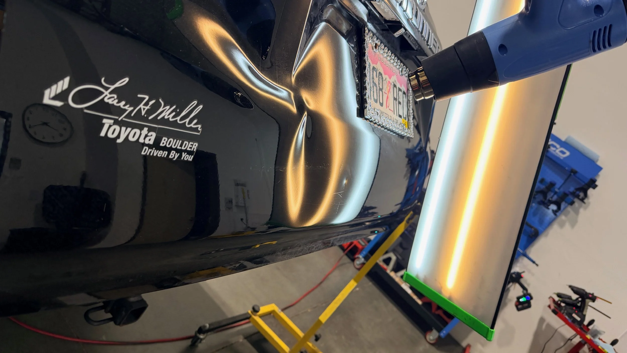 Rear impact dent highlighted under PDR reflection lighting