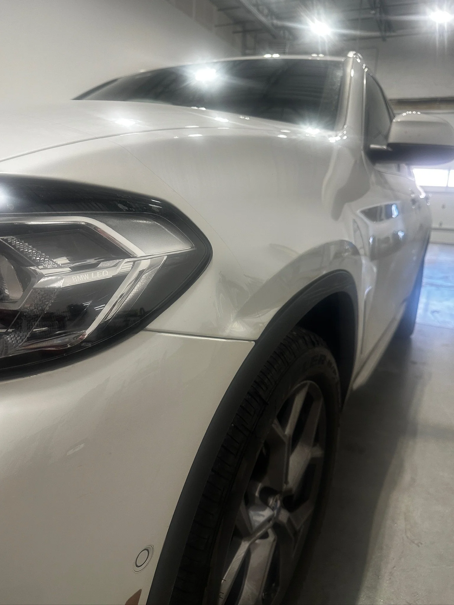Parking-lot damage being inspected for paintless dent repair