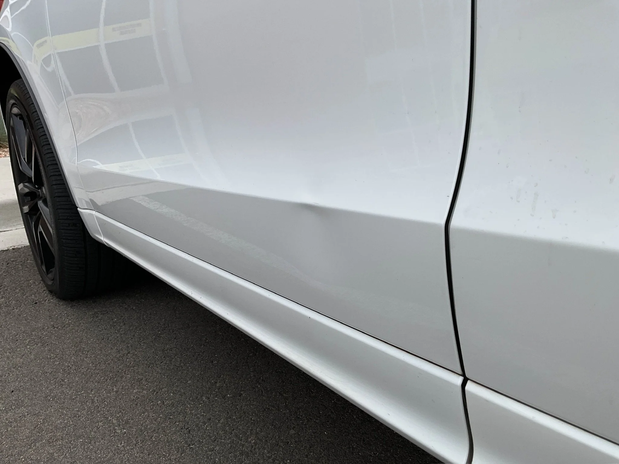 Bodyline crease before paintless dent repair in Arvada Colorado