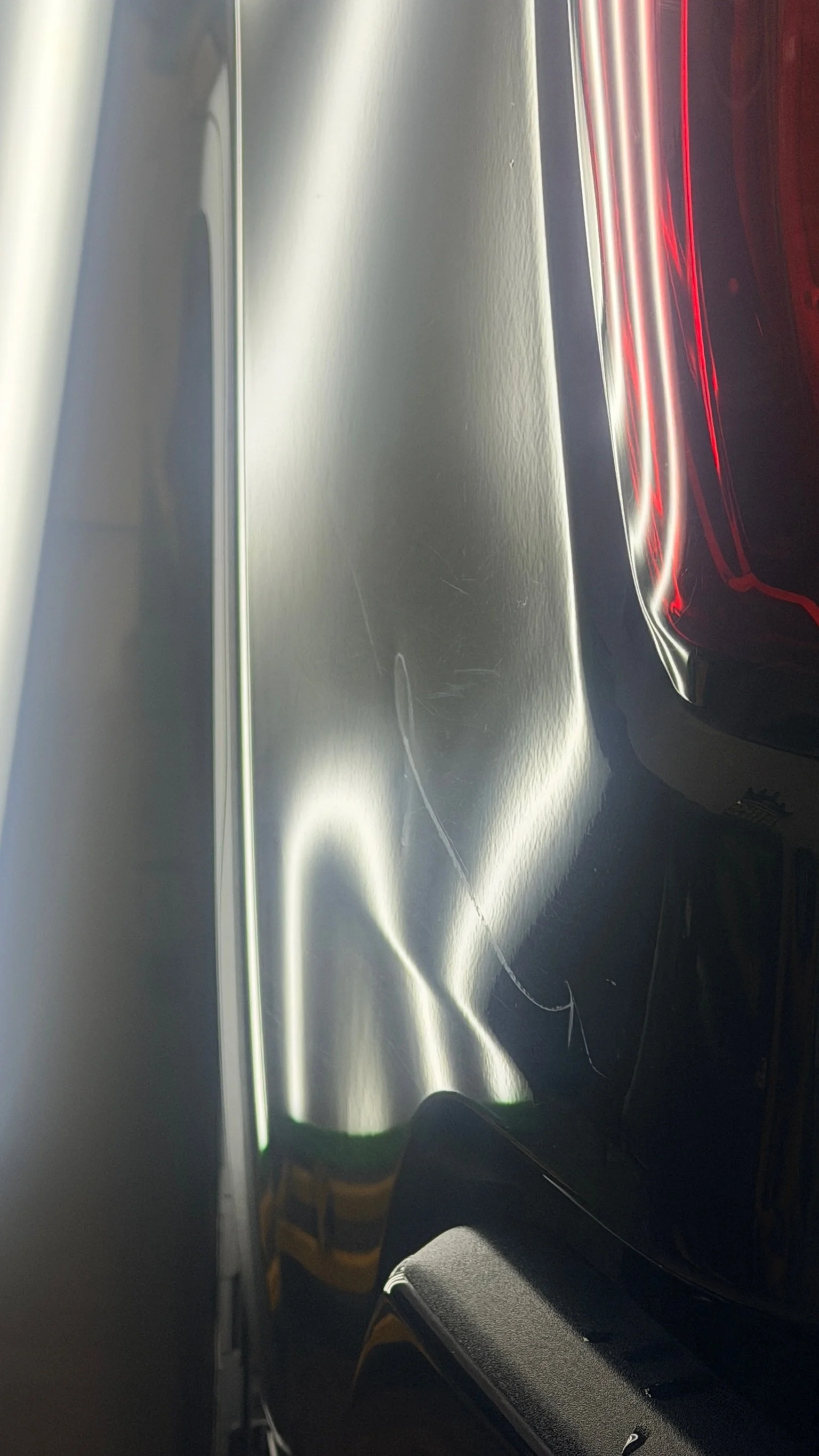 Door ding removal using specialized PDR tools and lighting